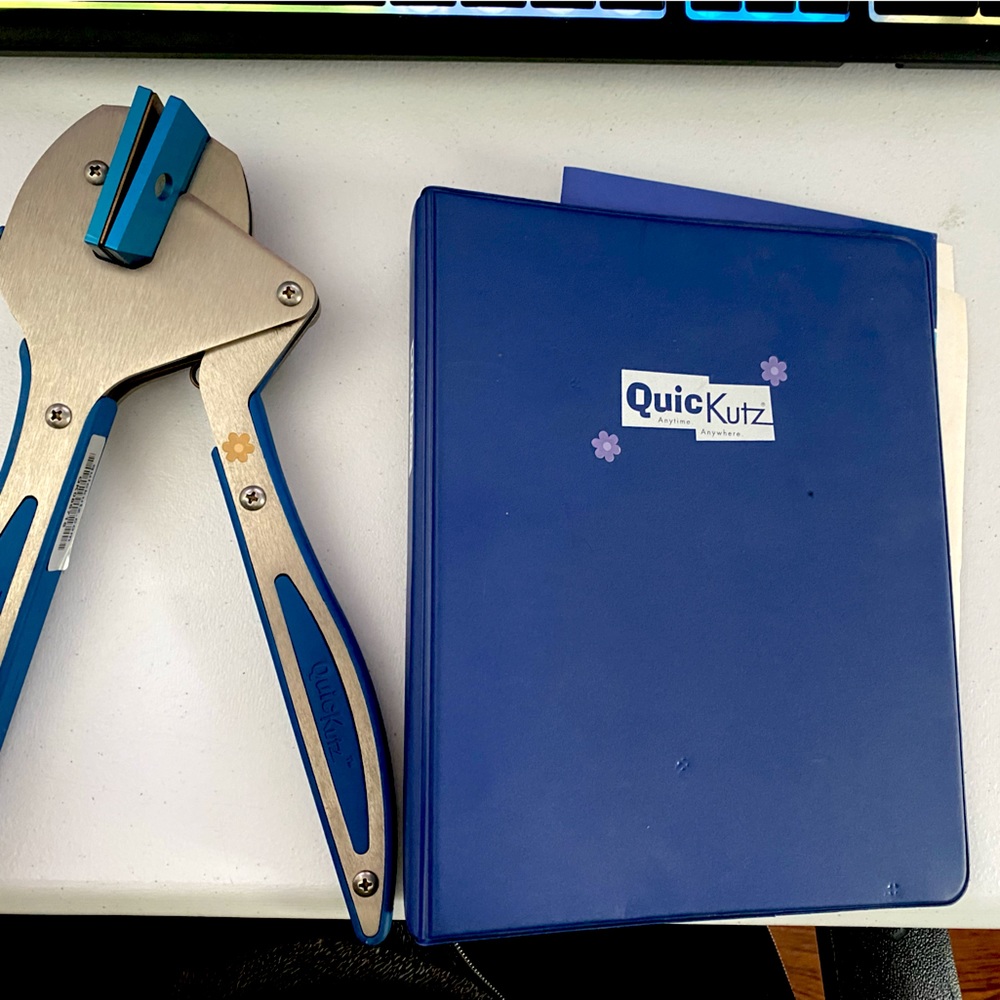 Quickutz Hand Tool and Small Binder of Embossing Dies